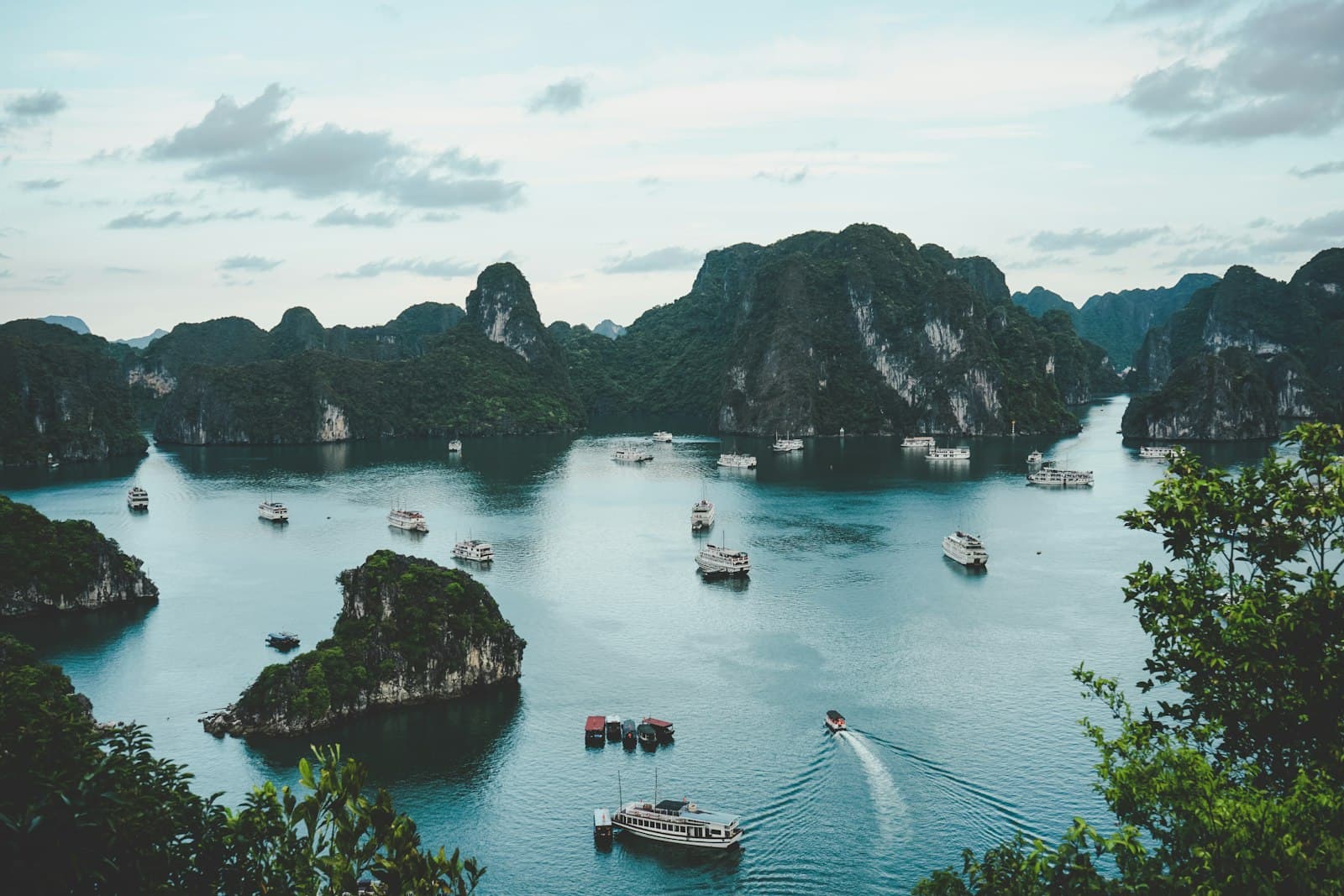 Limestone karsts and cruise boats scattered across Ha Long Bay, Vietnam