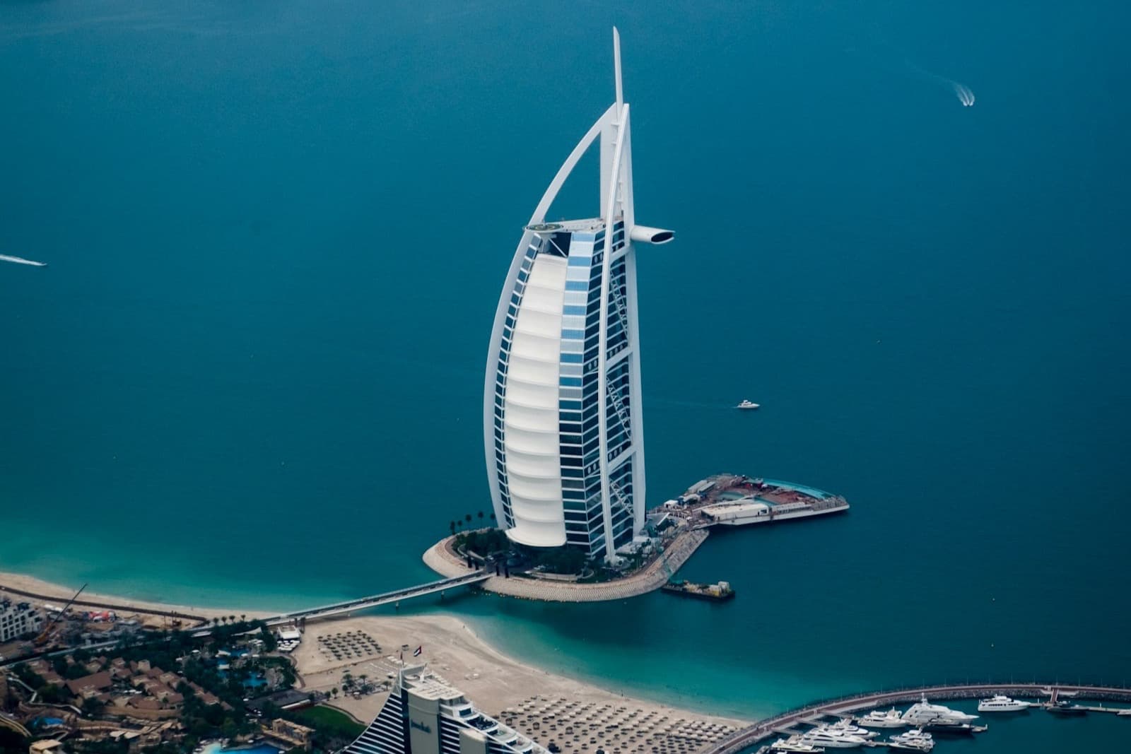 Aerial view of the Burj Al Arab, Jumeirah beach and the marina on the Dubai coast